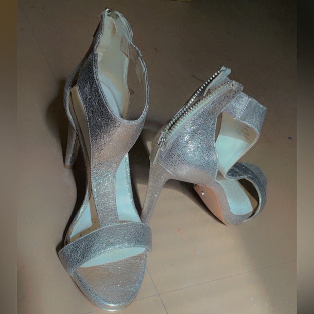 Size 6, gold/metallic stiletto high heel. Has been used.